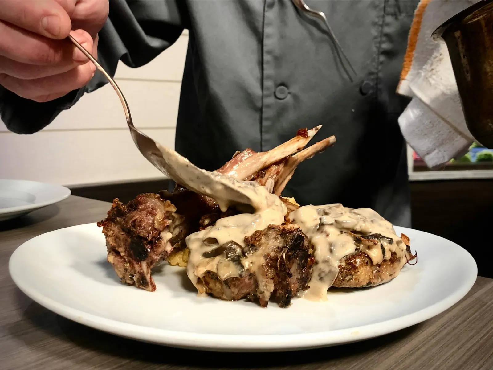 Chef plating rack of lamb