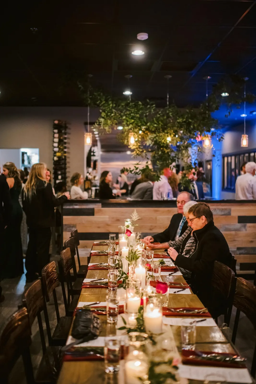 The full restaurant set with long tables for a buyout event