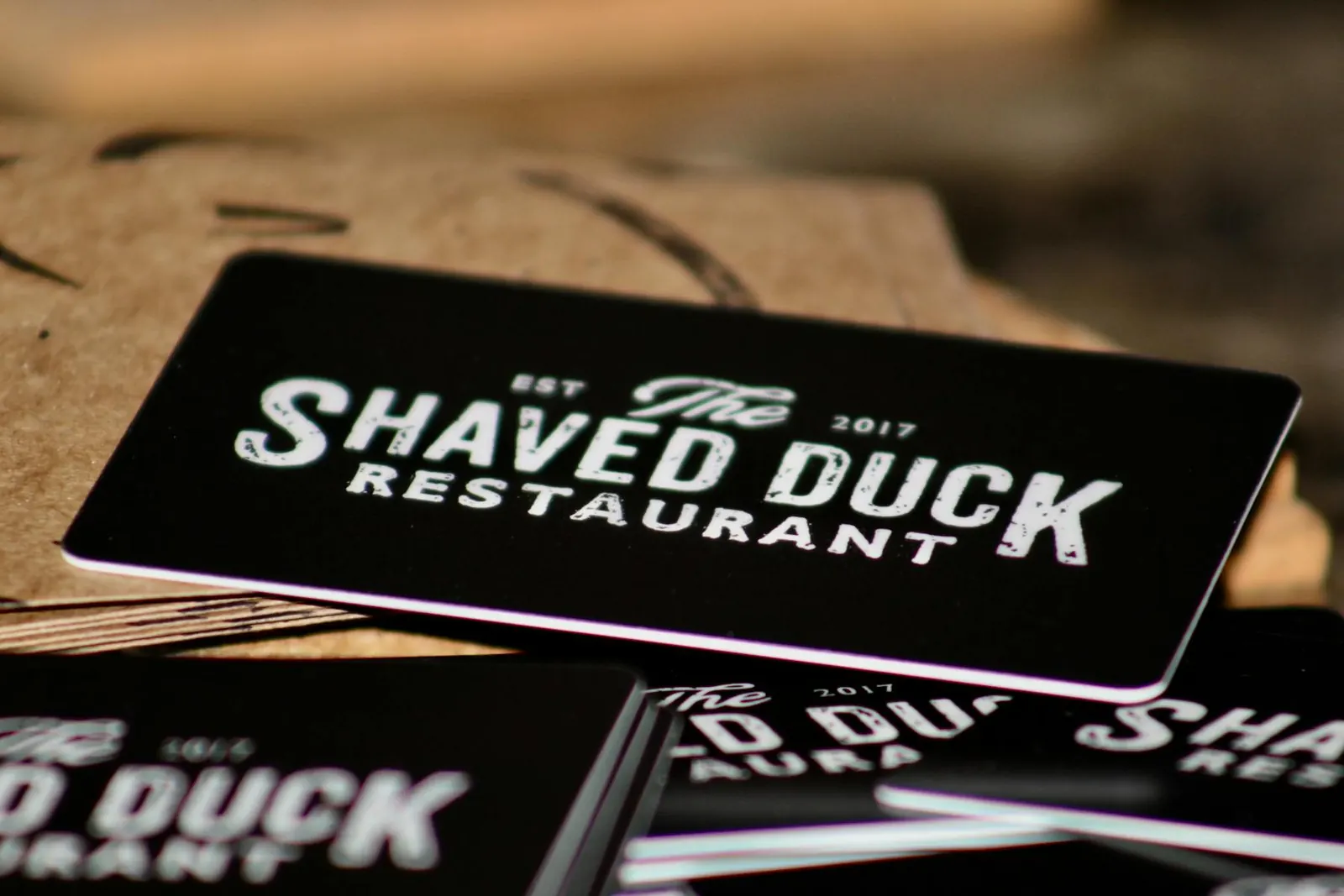 Shaved Duck gift cards on a table