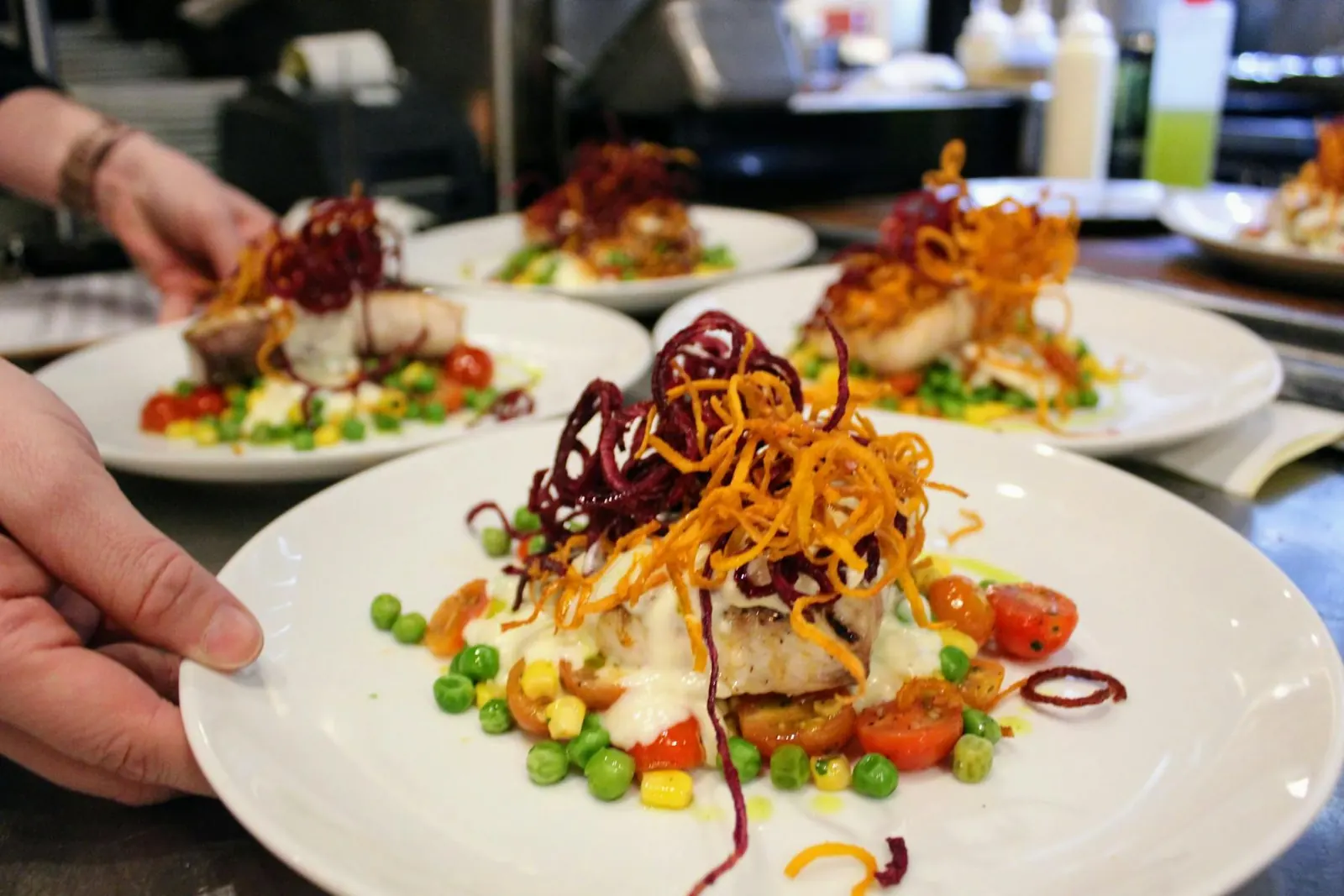 Plated fish course served at a private dinner